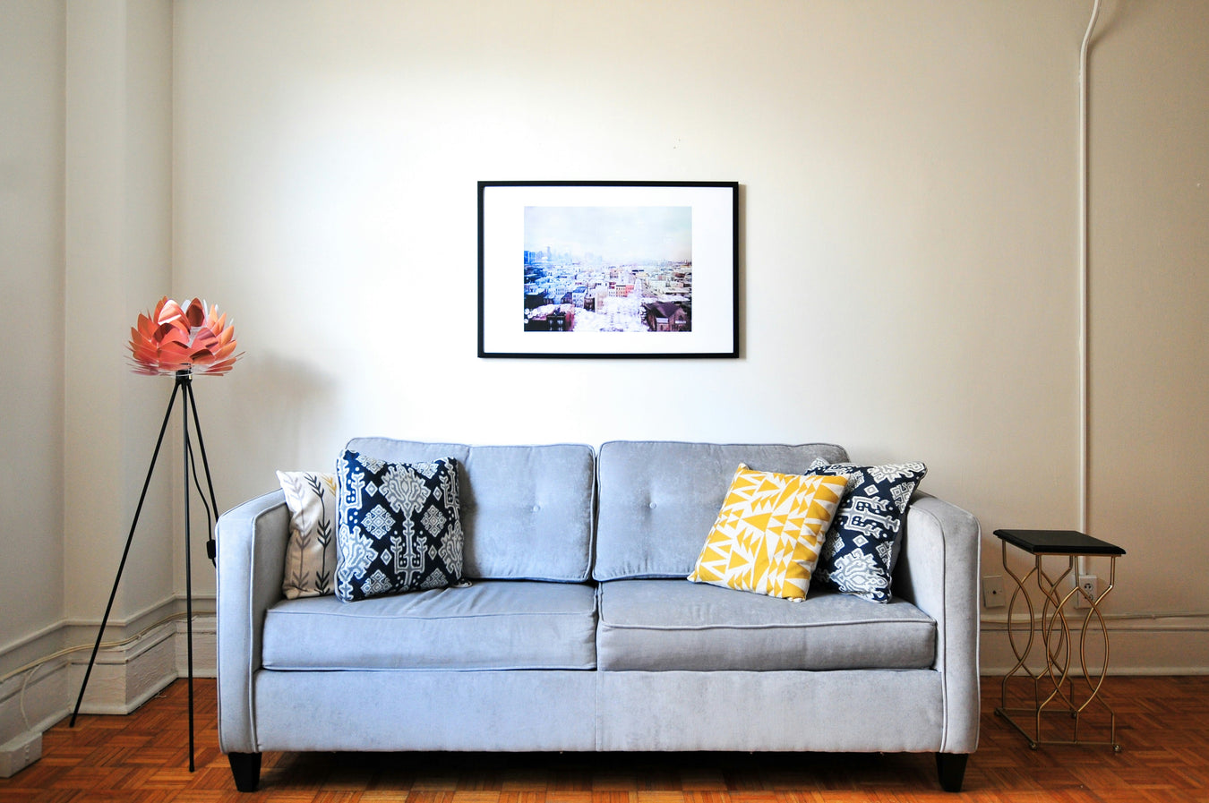 Elegant home decor featuring a modern living room with stylish furniture, wall art, indoor plants, lighting, and decorative accessories.