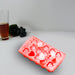 Heart-shaped silicone ice cube tray, enhances drink presentation.