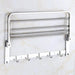 Stainless steel towel bar with foldable rack, 18 inches for compact bathroom storage.