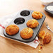 Versatile non-stick cupcake baking tray for home use.