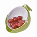 Washing bowl with strainer and handle for efficient fruit and vegetable cleaning.