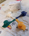 Close-up of bird wall hooks for holding accessories