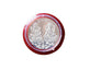 Pooja Coin with packaging displayed on cloth