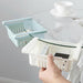 Adjustable fridge basket, showing expansion feature