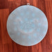 Acupressure foot mat with a built-in scrubbing brush for easy foot care.