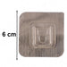 Transparent wall hook attached to smooth indoor surface